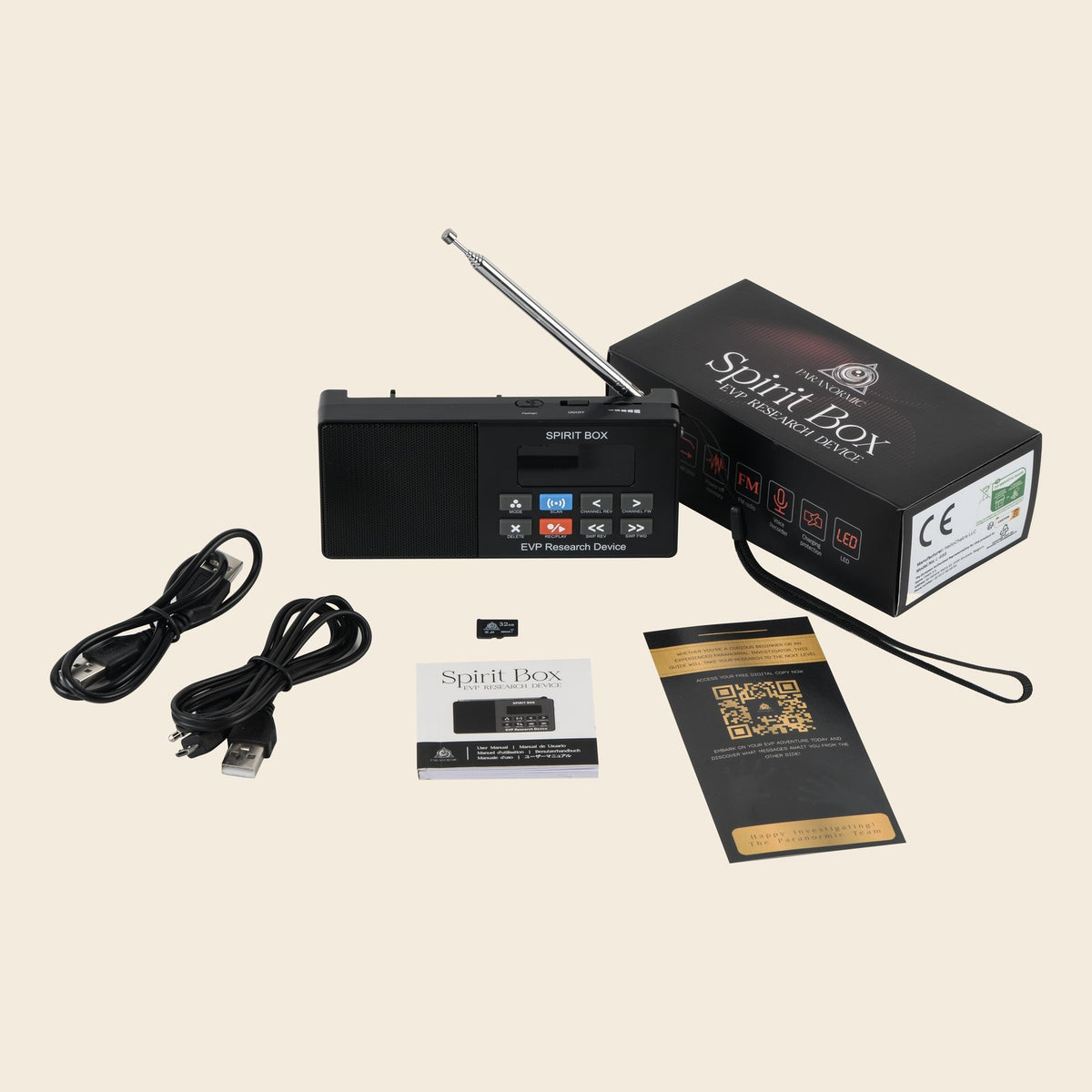 The Spirit Box kit on a plain background: device with strap, printed box, two USB cables, 32GB card, user manual and guide card.