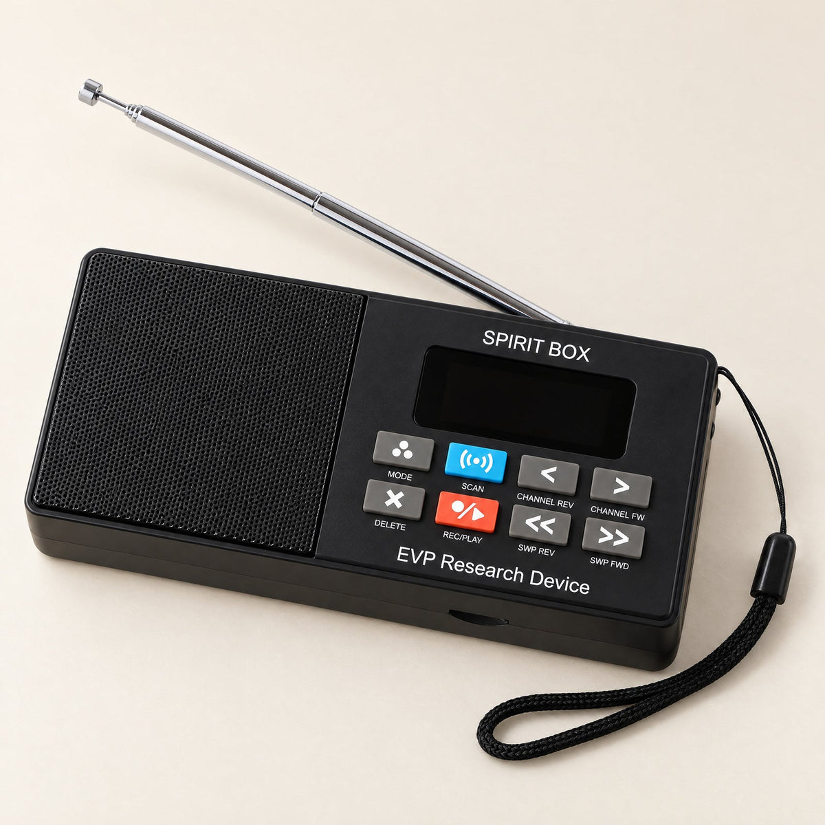 Paranormic Spirit Box with silver antenna and wrist strap on an ivory tabletop.